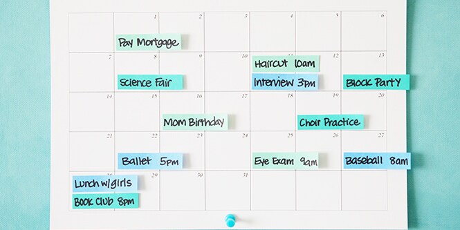  A calendar with various tasks, activities, and events written on Post-it® Index Flags
