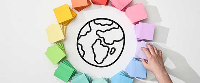 Colourful Post-it® Notes arranged in a circle around a drawing of Earth
