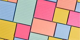 An arrangement of various sized Post-it&reg; Notes in pastel and bright colours, creating a pattern
